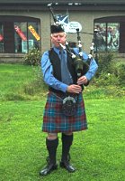 Piper at the Scottish Woolen Centre in Aberfoyle